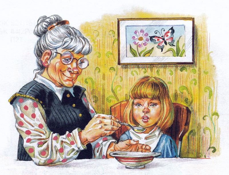 Бабушка кормит внучку