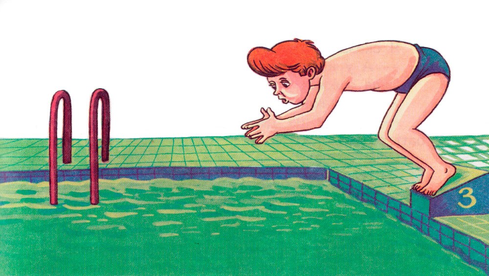 Мальчик ныряет в бассейн